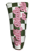 Checkered golf club head cover with pink text on a white background