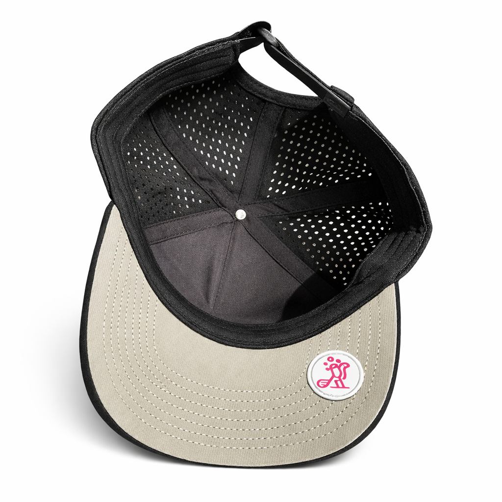 Inside view of Birdies & Bubbles women's black performance golf hat showing breathable perforated fabric panels, structured crown, and adjustable strap closure