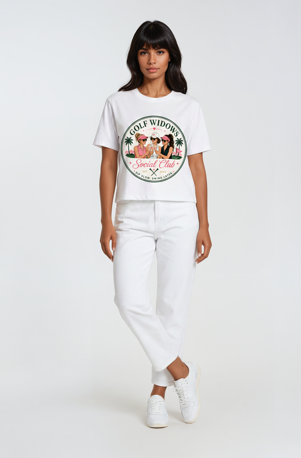 Person wearing a white t-shirt with a graphic design text Golf Widows Social Club on a white background