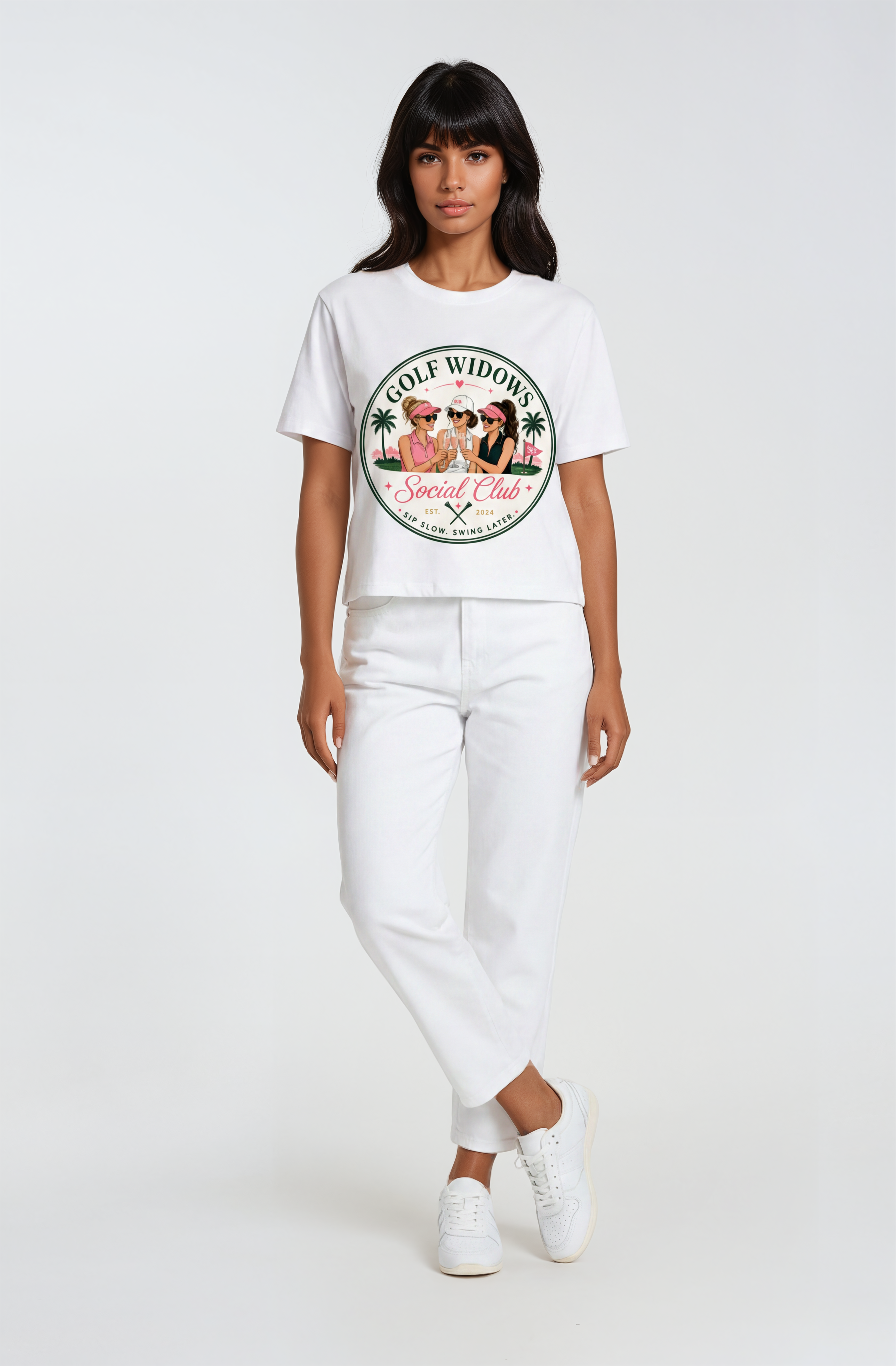 Person wearing a white t-shirt with a graphic design text Golf Widows Social Club on a white background