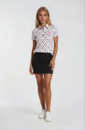Woman wearing a patterned white shirt and black skirt Birdies and bubbles par tee pour polo