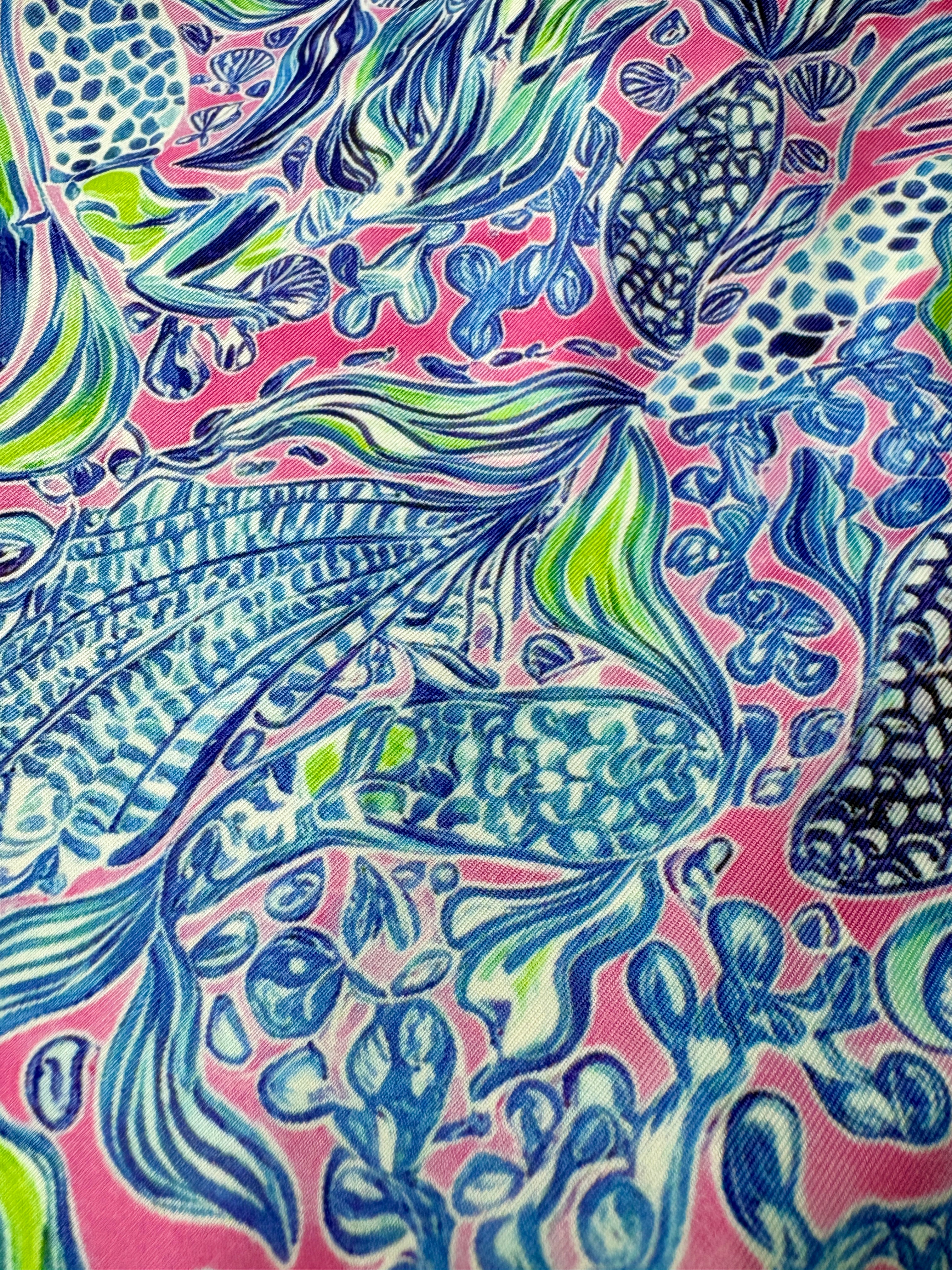fairway-favorite-womens-golf-dress close up of print with the pink, blue and green pattern 