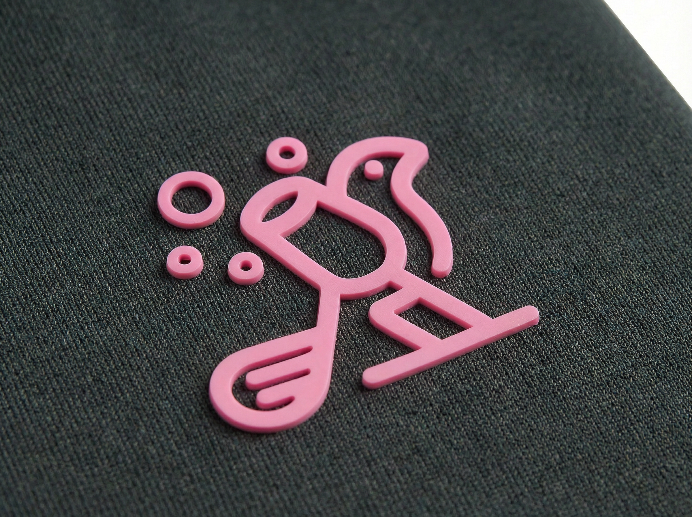 Pink logo on a black background